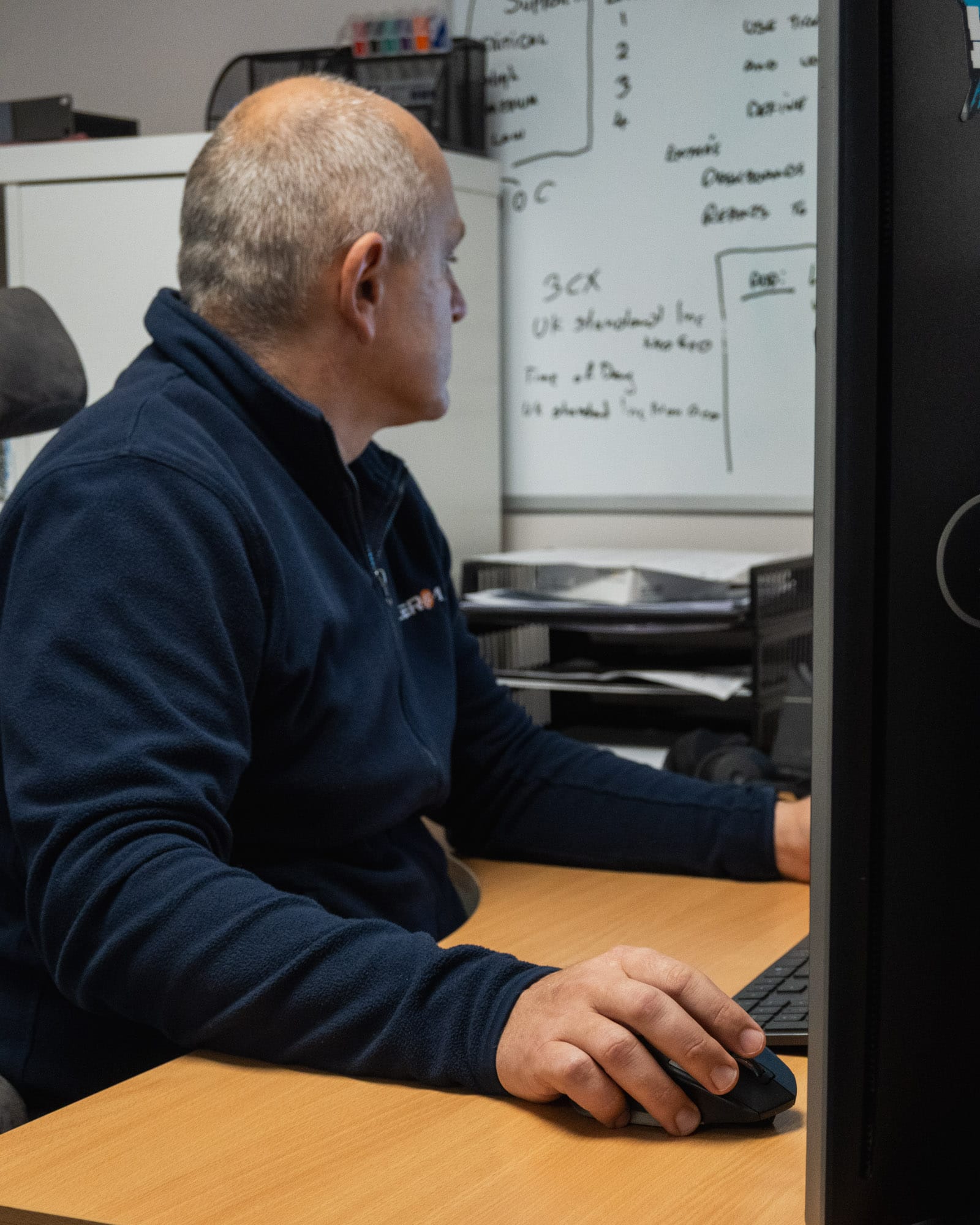 staff member from 1 zero 1 doing IT on computer