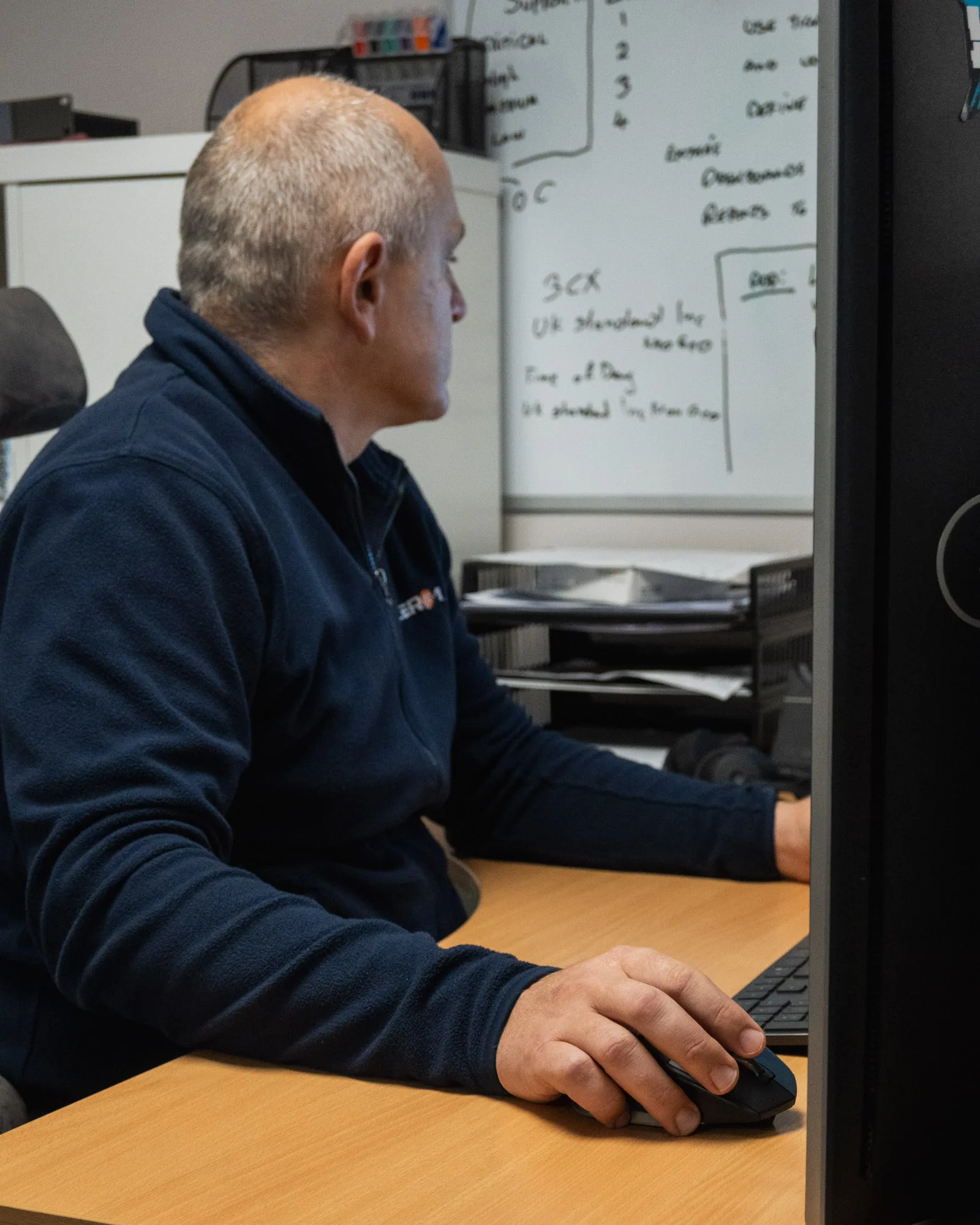 staff member from 1 zero 1 doing IT on computer